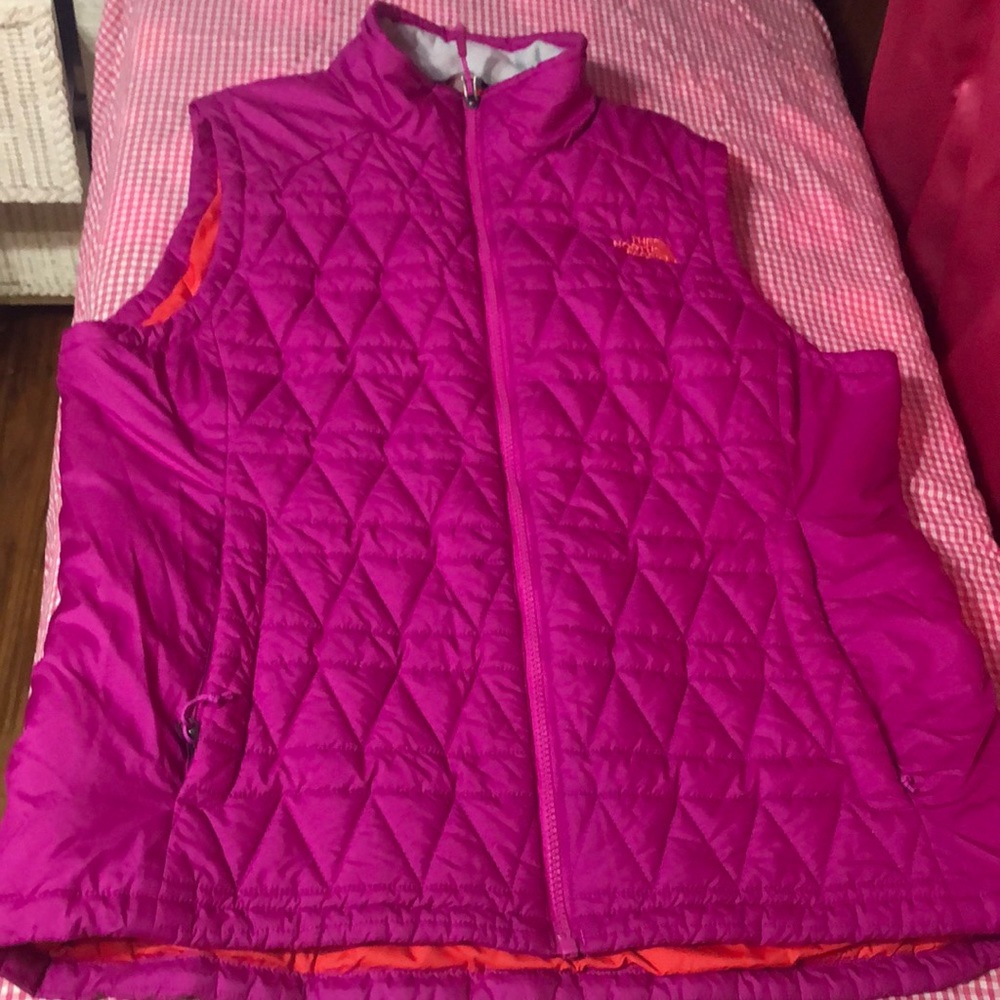 The North face vest excellent condition pink with orange interior.
